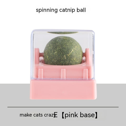 Two spinning catnip balls, one with a green base and one with a blue base, in clear plastic cases. - Image 4