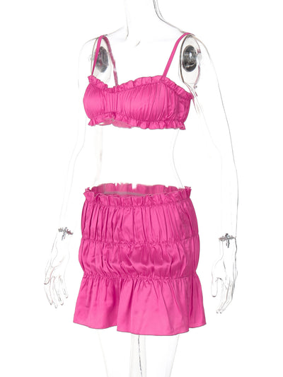 Fuchsia ruched tube top and matching pleated mini skirt set on a woman, perfect for summer. - Image 12
