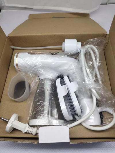 White and gold handheld folding steam iron with clear cistern, long bristle brush, fluff brush, and measuring cup. - Image 9