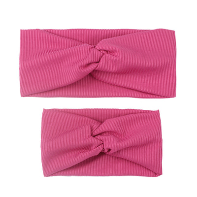 Matching dusty rose ribbed knit headbands with a twisted knot, one for an adult and one for a child. - Image 13