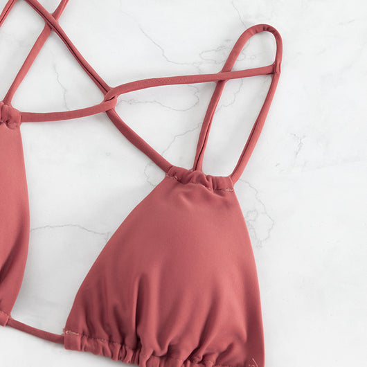 Red bean paste women's bikini swimwear with a triangle top and high-cut double-strap bottoms, laid flat. - Image 10