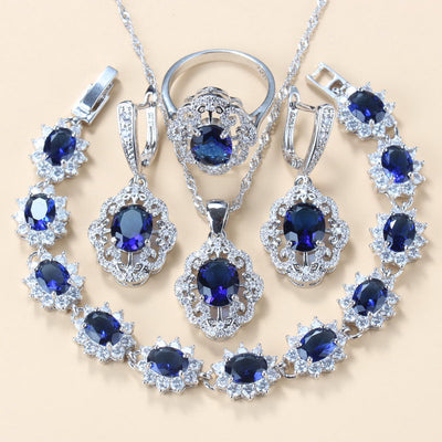 Four-piece jewelry set with silver-tone settings, featuring oval purple cubic zirconia stones surrounded by clear accents. - Image 11