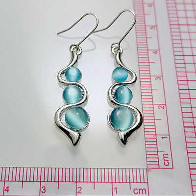 Aretes Ondulados Estilo Bohemio con Gema Ojo de Gato - Image 7