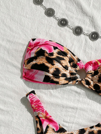 Women's tube top bikini swimsuit with a pink floral and leopard print, featuring a twisted front top and high-cut ruched bottom. - Image 12