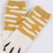 Calcetines de rayas amarillas con pata de gato