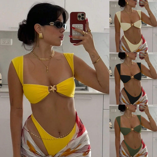 Bright yellow bikini with wide shoulder straps and a gold metal decoration on the top, worn by a woman.