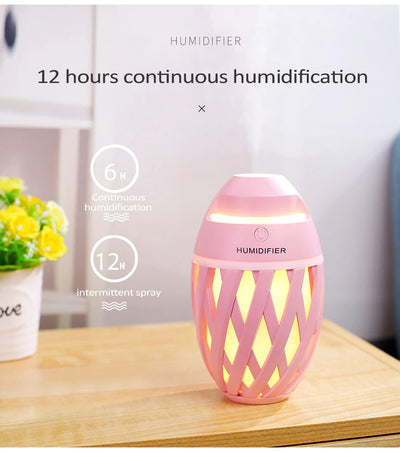 Light green football-shaped humidifier with a decorative lattice pattern and a power button on top. - Image 14