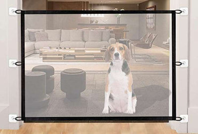 Black mesh pet gate installed at the bottom of a wooden staircase, with a golden retriever sitting in front. - Image 19