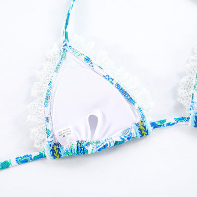 Women's blue and green paisley print bikini with white lace trim, triangle halter top, and tie-side bottoms. - Image 13
