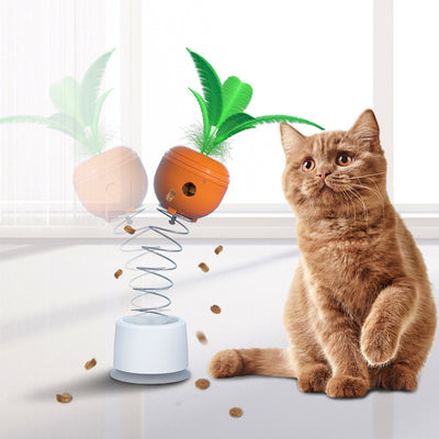 Orange carrot-shaped cat leaking food toy with green leaves, designed as a self-playing tumbler feeder.