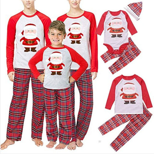 Young boy wearing a Christmas pajama set with a grey Santa Claus raglan shirt and red plaid pants. - Image 12