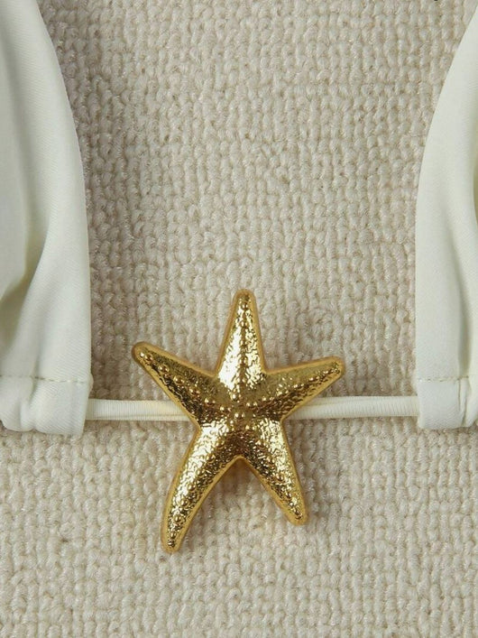 White two-piece bikini with triangle top and tie-side bottom, featuring a gold starfish charm. - Image 4