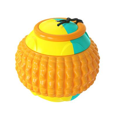 Blue, red, and beige plastic dog toy ball with a textured surface and black rope, next to a golden retriever puppy. - Image 4