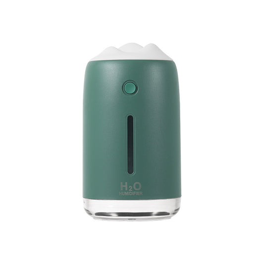 Dark night green mini humidifier with a white mountain-shaped top, clear base, and visible water level indicator.