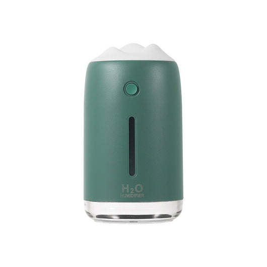 Dark night green mini humidifier with a white mountain-shaped top, clear base, and visible water level indicator.