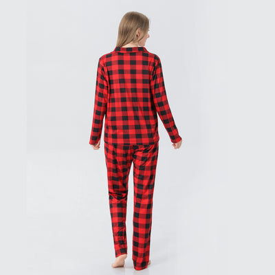 Baby in a red and black buffalo plaid long-sleeve pajama romper, viewed from the back with arms raised. - Image 30