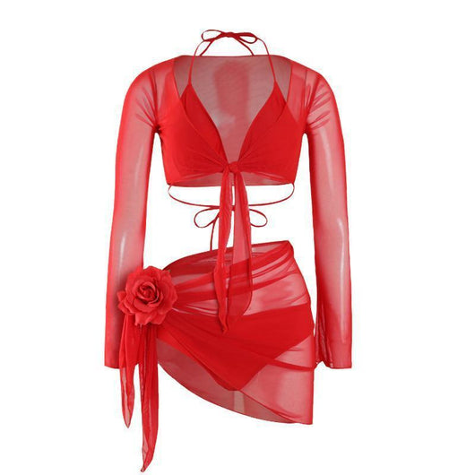 Red four-piece bikini set with sheer long-sleeve tie-front top and matching tie-front skirt on a beach. - Image 4