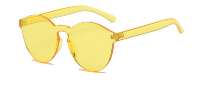 Frameless round brown transparent sunglasses with an integrated design, featuring jelly-like lenses and matching temples. - Image 13