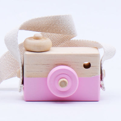 Two-tone wooden toy camera in natural wood and light blue with a cream fabric strap, for babies and kids. - Image 6