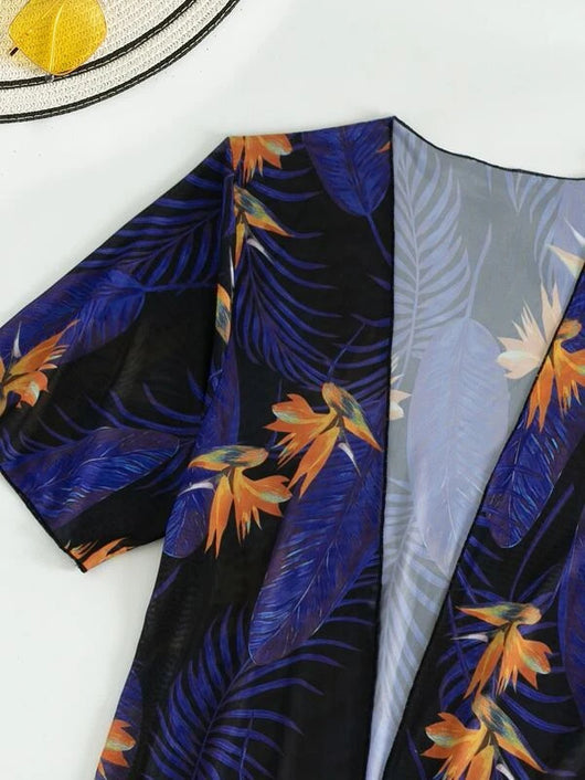 Women's tropical print one-piece swimsuit with deep V-neck and high-cut leg, paired with a matching long-sleeve cover-up. - Image 23