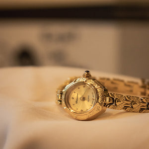 Reloj Antiguo de Cobre Dorado con Tiras Artesanales
