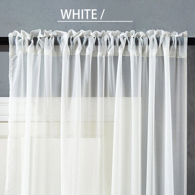 Sheer pink rod pocket curtain hanging on a black curtain rod, offering light transmission for a modern room. - Image 2