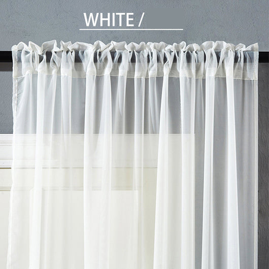 Sheer pink rod pocket curtain hanging on a black curtain rod, offering light transmission for a modern room. - Image 2