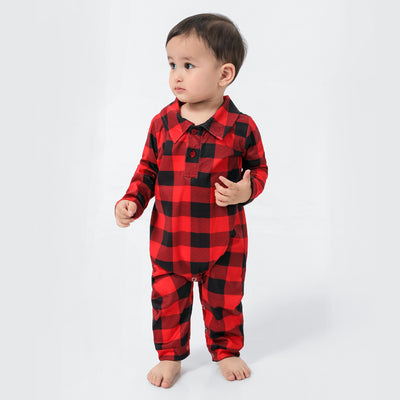 Baby in a red and black buffalo plaid long-sleeve pajama romper, viewed from the back with arms raised. - Image 26