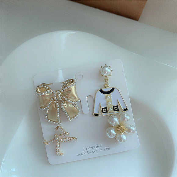 Broche Floral con Perla y Moño Metálico
