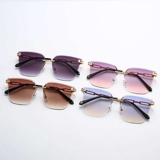 Frameless oversized square sunglasses with brown gradient lenses and gold-tone metal temples, featuring decorative black studs. - Image 3