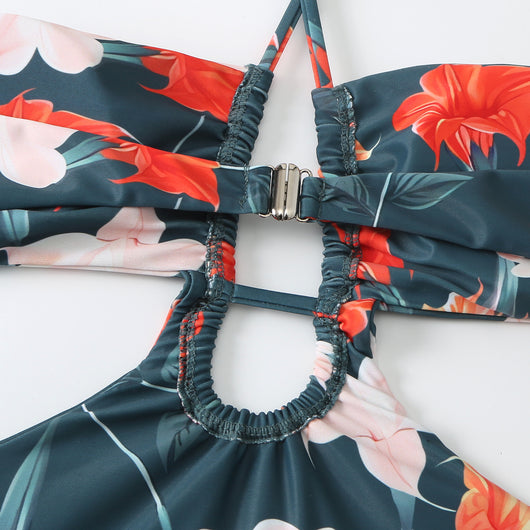 Dark green floral one-piece swimsuit with halter neck, bandeau top, cut-outs, and matching sheer sarong. - Image 23