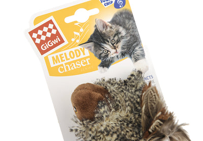 Silver tabby cat playing with a plush bird toy featuring brown and patterned feathers, a brown head, and a yellow beak. - Image 11