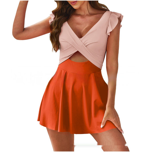 Conservative color contrast patchwork swimsuit for women, featuring a light pink criss-cross top with ruffled cap sleeves and an orange pleated skirt. - Image 8
