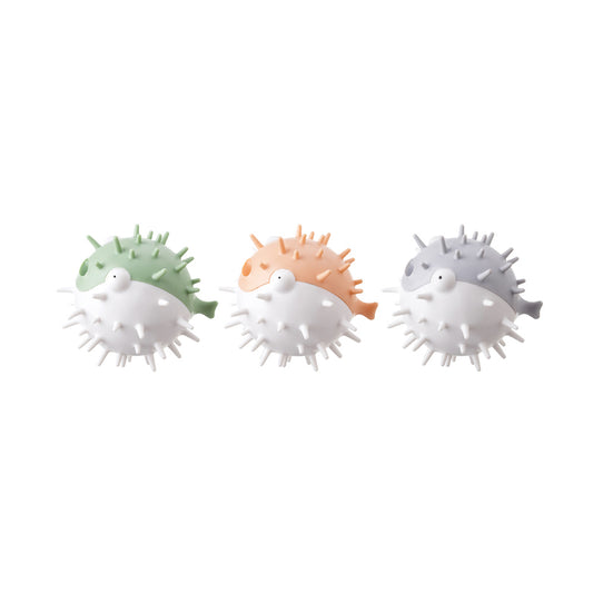 White and grey pufferfish-shaped dog toy with spikes, designed to be bite-resistant and vocal.