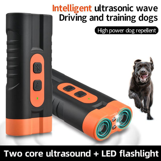 Black and orange handheld ultrasonic dog repellent with two sound emitters and two control buttons.