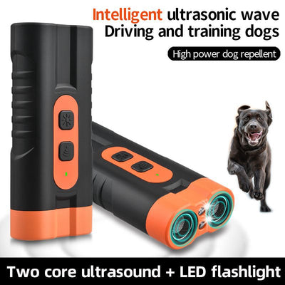 Black and orange handheld ultrasonic dog repellent with two sound emitters and two control buttons.