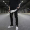 Elastic Slim Trousers with Zip Fastening and Leather Drawstring Detail