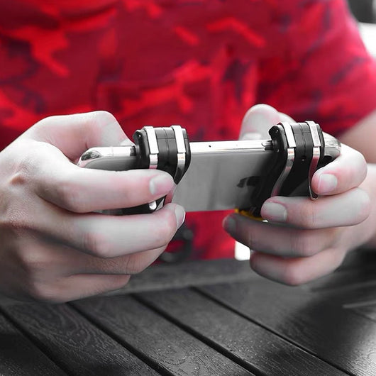 Black and silver mobile gaming trigger controller attached to a silver smartphone, showing the left button and game screen. - Image 3