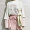Blusa blanca con mangas bicolor efecto dos piezas