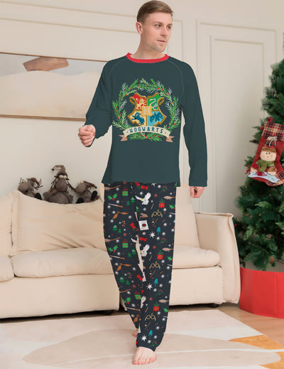 Family of four wearing matching dark green Hogwarts pajamas with a festive Harry Potter pattern, posing by a Christmas tree. - Image 3