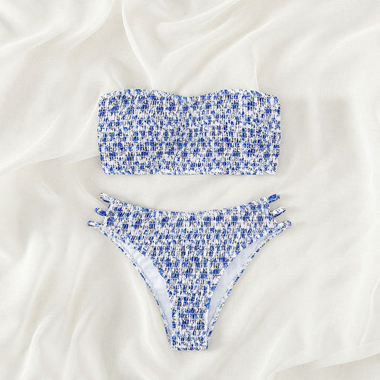Floral smocked strapless bandeau bikini with high-cut bottoms featuring side straps, in white, teal, and red. - Image 2