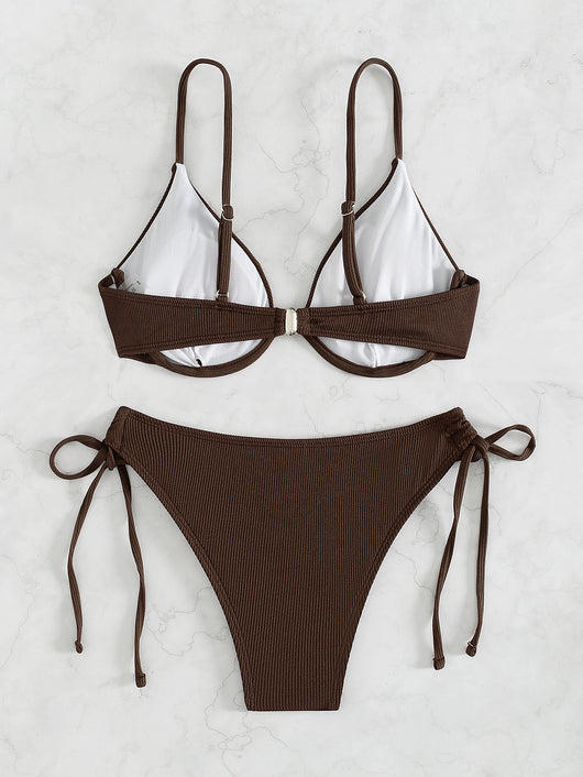 Black ribbed two-piece bikini with an underwire top and tie-side bottoms on a white marble surface. - Image 18