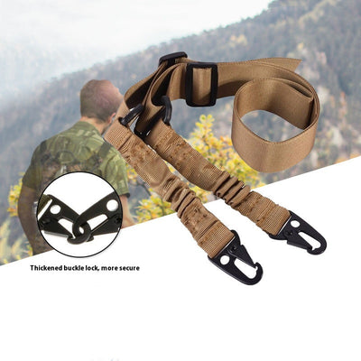 Black crossbody nylon strap with elastic sections, adjustable buckles, and two metal hooks for tension adjustment.