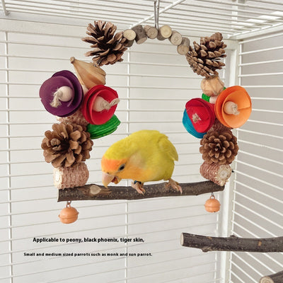 Natural wood parrot swing with pine cones, colorful wooden pieces, and small bells for chewing and perching. - Image 6