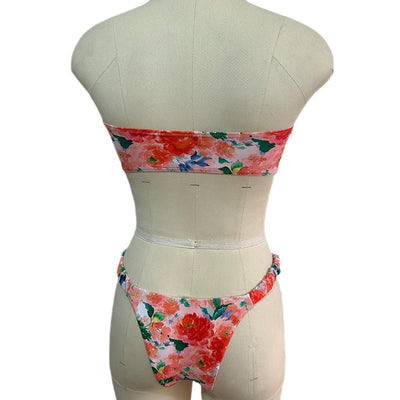 Floral print tube top bikini with blue and purple flowers, white lace trim, and a central ring detail. - Image 4