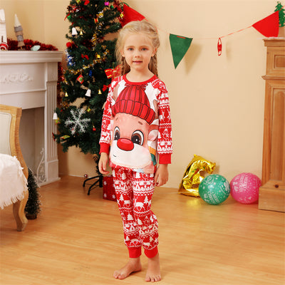 Baby wearing a red and white Christmas pajama set with a fawn graphic, sitting on a white blanket. - Image 3