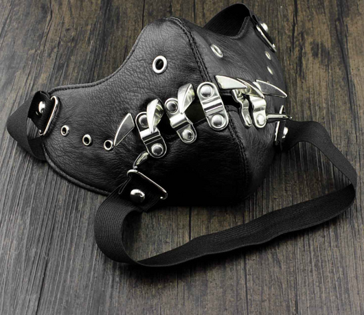 Black leather half-face mask with brass chains, spikes, and gear accents, featuring adjustable elastic straps. - Image 6