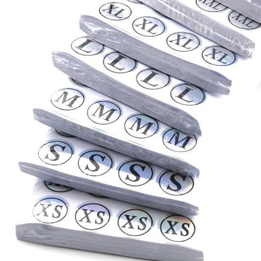 Stack of round clothing size stickers with laser color-changing background and black text, from XS to 4XL. - Image 15
