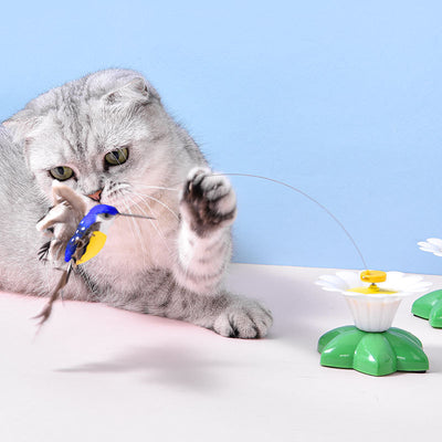 Automatic cat teaser toy with an electric rotating bird on a steel wire, attached to a green and white flower base. - Image 4