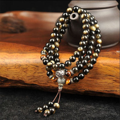 Pulsera de Obsidiana Dorada con 108 Cuentas Buda y Plata Tibetana - Image 8